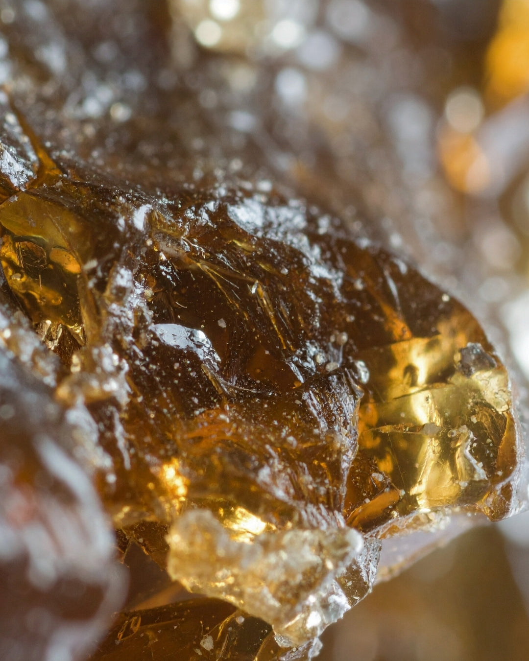 A backlit piece of golden amber resin