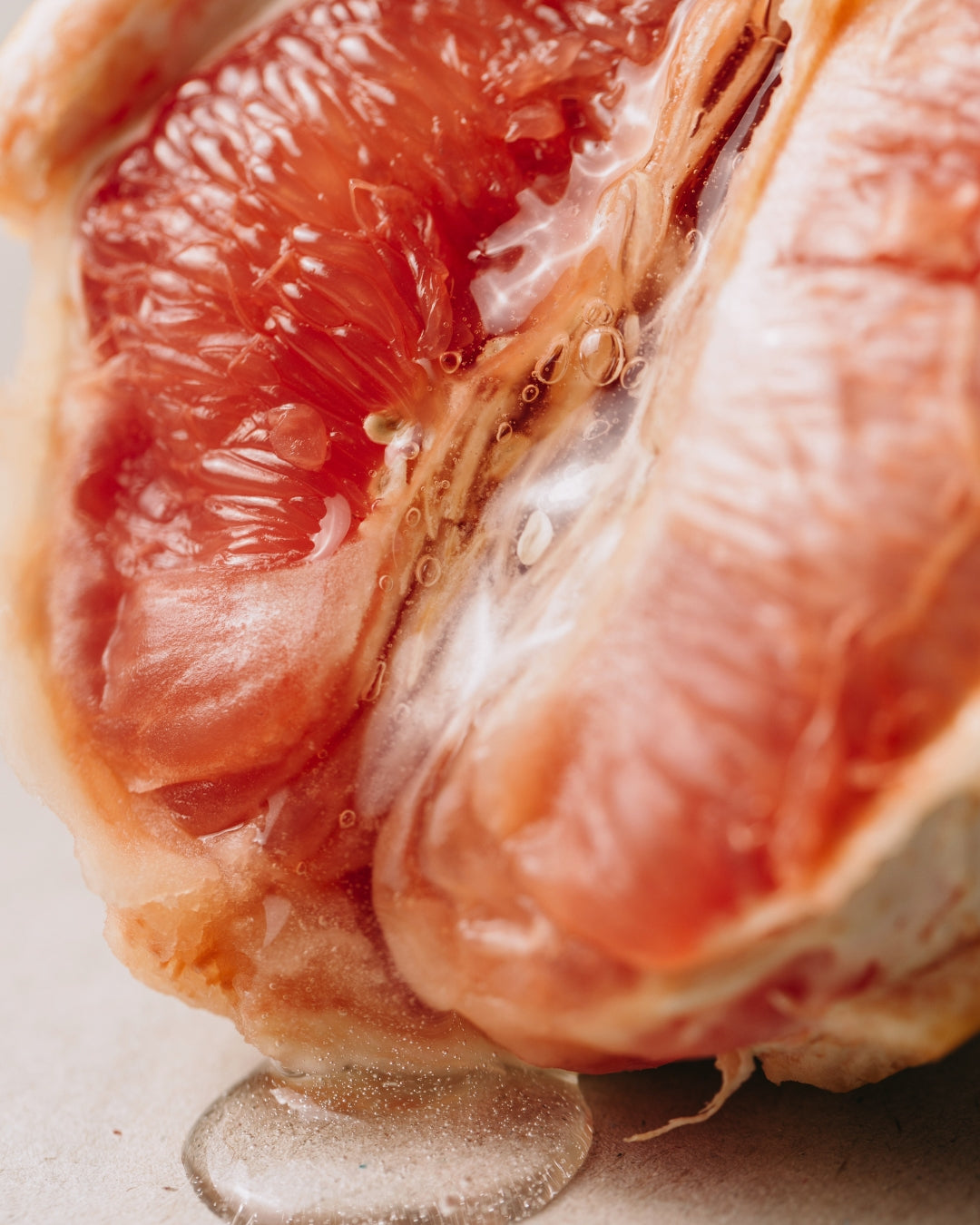 The cut flesh of a blush tangerine in close-up